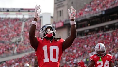 Denzel Burke ejected for targeting in Ohio State vs Western Michigan game. See the play