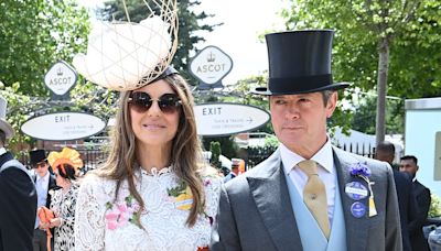 Elizabeth Hurley steps out on the arm of her poet pal at Ascot