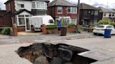 Huge sinkhole suddenly opens up on busy road, bringing traffic to standstill