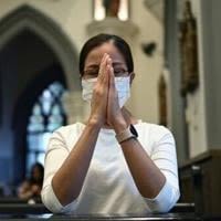 A Singaporean Catholic prays during mass at St. Joseph's Church in Singapore on September 10, 2024, ahead of Pope Francis' visit to the city state.