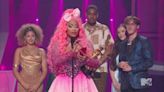 Nicki Minaj says she wishes Michael Jackson and Whitney Houston were at the VMAs while receiving Video Vanguard Award.