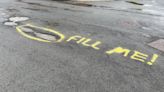 York graffiti highlights city's potholes problem