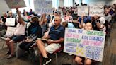 More than 100 people pack Francis Howell meeting to protest gender, library proposals