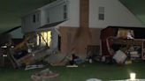 Car crashes into Covington home, barely missing residents