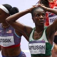 Nigeria's world record holder Tobi Amusan reacts after failing to qualify for the Olympic 100m hurdles final