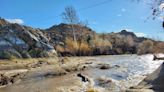 The normally dry Mojave River is still flowing in the High Desert. Can you guess why?