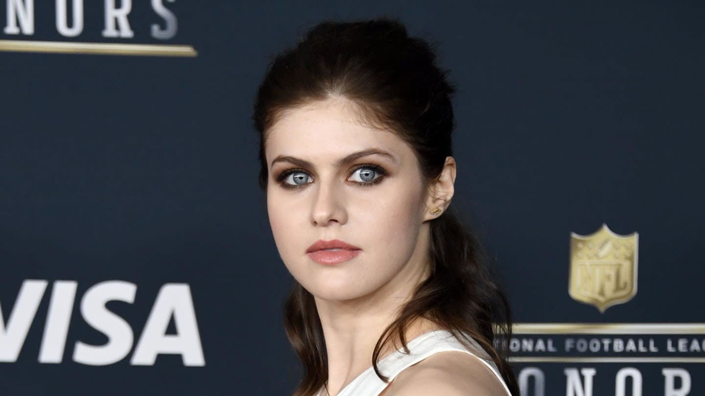 Only Alexandra Daddario Can Mix a Printed Dress and Plaid Coat and Still Look Super Chic