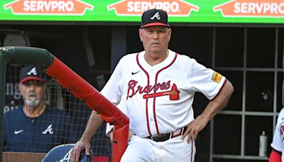 Braves manager Brian Snitker OK after taking Ozzie Albies foul ball to the groin