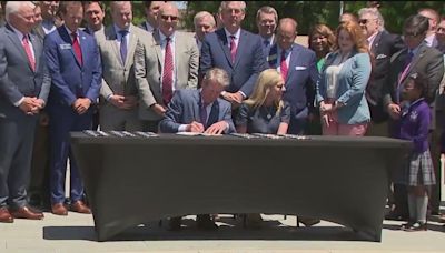 Kemp signs Georgia school voucher bill amid controversy