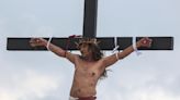 A Filipino villager is nailed to a cross for the 35th time on Good Friday to pray for world peace