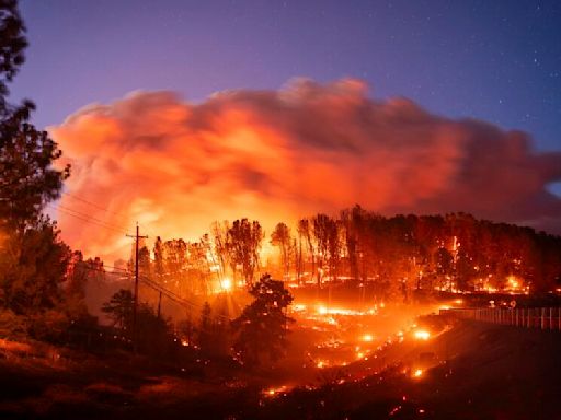 California's largest wildfire explodes in size and destroys scores of buildings