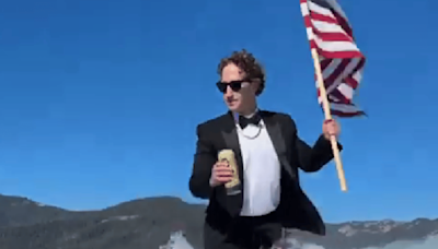 Mark Zuckerberg Celebrates July 4th Surfing In A Tuxedo With Beer And US Flag—It's All Real