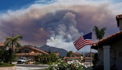 Man arrested on arson charges as wildfires burn out of control in Southern California and more evacuations are ordered | CNN