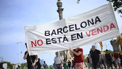 Protesters spray water guns at tourists in Barcelona as thousands rally against overtourism