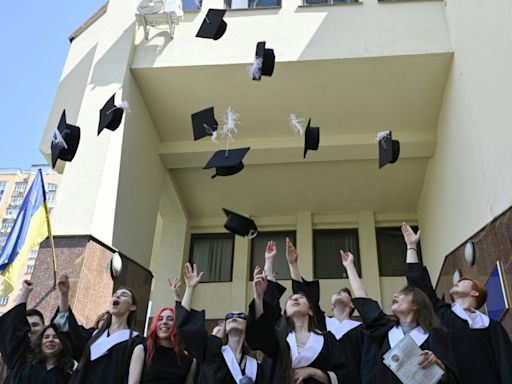 War, uncertainty push proud Ukraine graduates to 'live now'