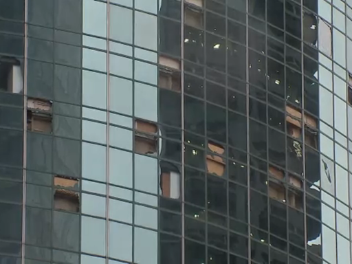 Downtown Houston riddled with glass after storm tore windows out of high-rise buildings