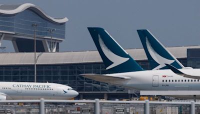 Cathay Pacific says profit drops on lower fares, growth plan on track