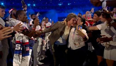 People are horrified after woman lunges at Tom Cruise during Olympics ceremony