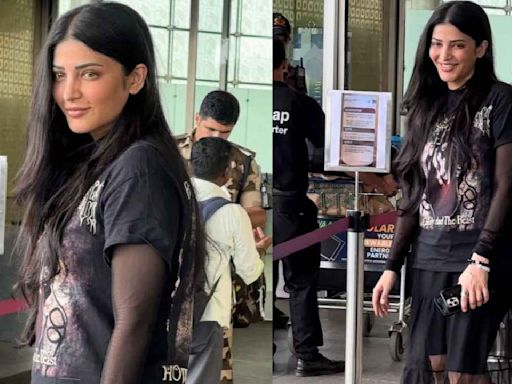 Shruti Haasan gives a gothic twist to airport fit with graphic tee, tulle skirt and shorts