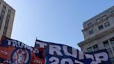 Flags in support of former US president Donald Trump outside of Manhattan Criminal Court