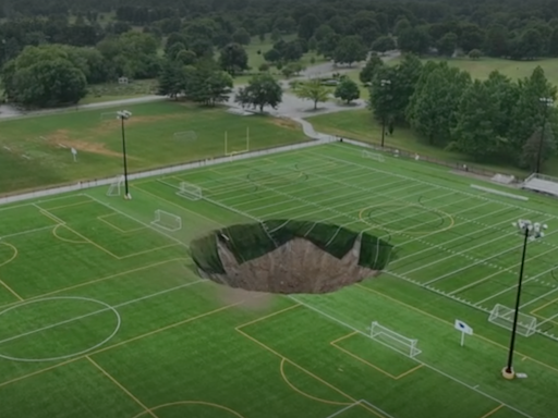 Security cam captures moment giant sinkhole swallows football pitch in Illinois