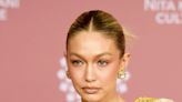 Gigi Hadid Stuns In A Gold Ensemble At The NMACC Gala In Mumbai