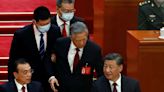 Chinese ex-President Hu Jintao escorted out of party congress