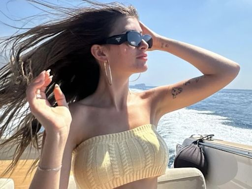Sami Sheen wows in a bra top and shorts on a boat in Capri