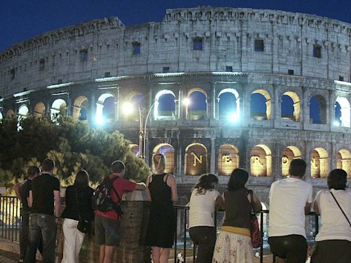 Visitors enjoy awesome spectacle of Rome's Colosseum at night