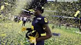 Michigan Wolverines run away from Washington Huskies to win College Football Playoff title game 34-13