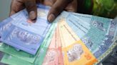 Malaysia companies brace for costly fallout as Ringgit hits a 26-year low