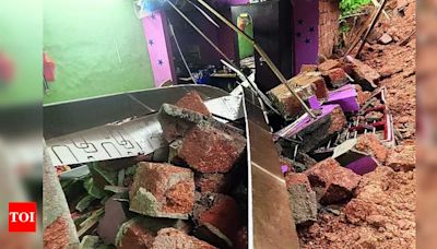 Family narrowly escapes after wall collapses in Puttur | - Times of India