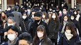 Japan to lower COVID-19 to flu status, further easing rules