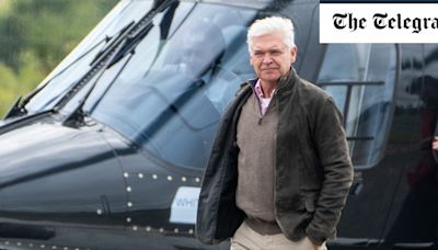 Philip Schofield arrives at Silverstone by helicopter