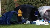 Hundreds of asylum seekers in encampment at Seattle park after funding for hotel stay runs out