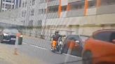 Terrifying moment crazed driver forces biker off his motorcycle