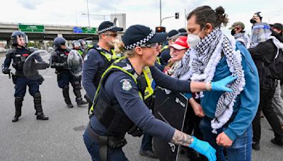 Anti-war protesters clash with police outside Australian arms convention