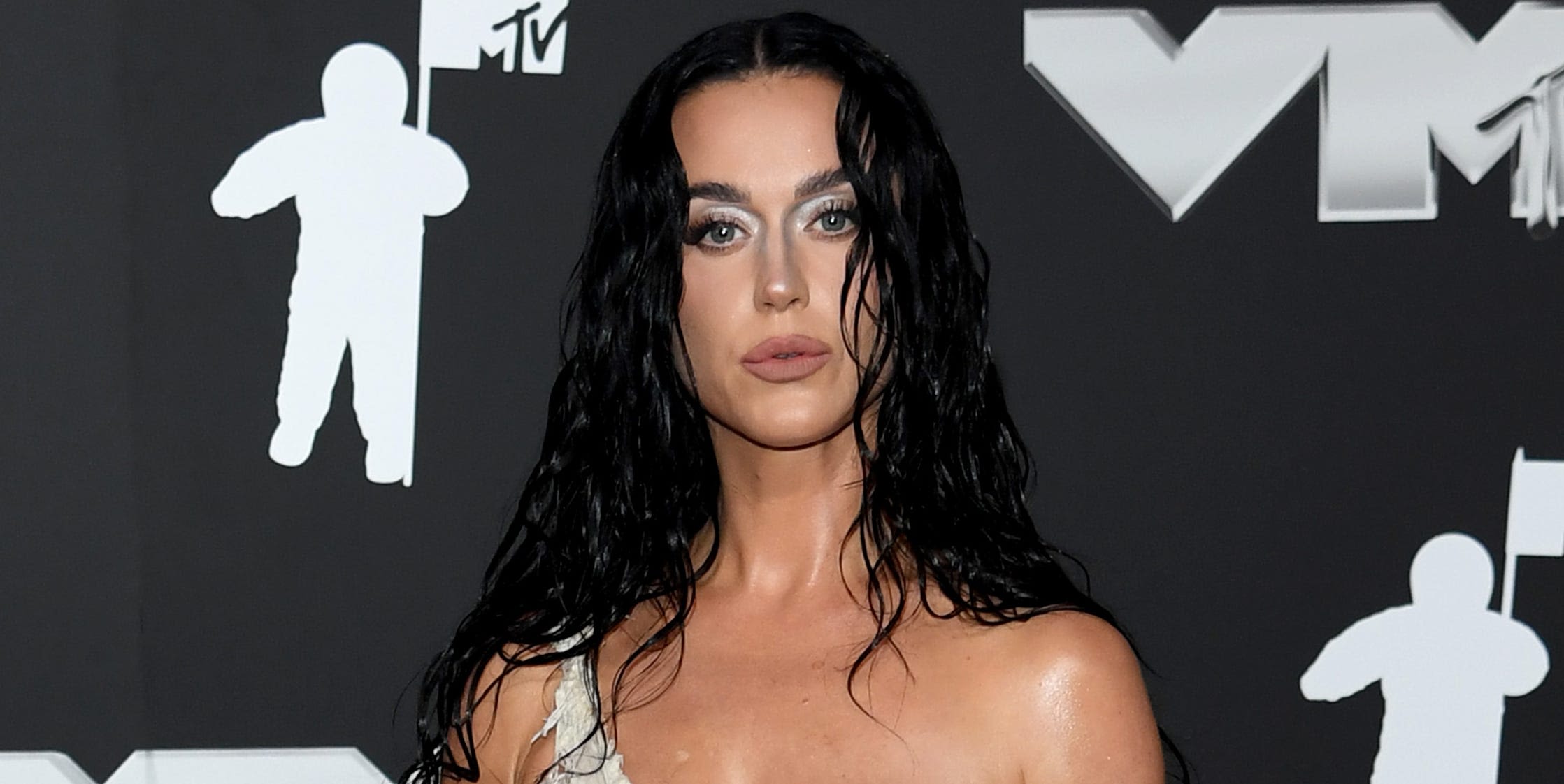 Katy Perry wows in a shredded bra top and skirt on the 2024 VMAs red carpet