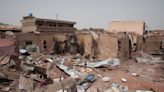 Aid group says over 100 people killed in 2 weeks of fighting in a Sudanese city