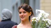 Suri Cruise buys herself flowers on 18th birthday as father Tom films in UK