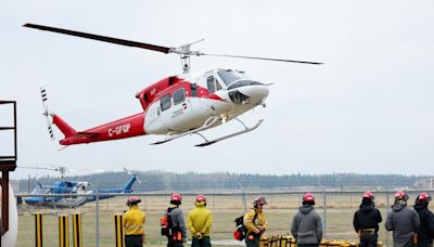 Rain helps stall wildfire near Canadian oil city