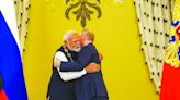 Russian President Vladimir Putin embraces PM Narendra Modi when the latter was conferred with the ‘Order of St. Andrew the Apostle the First-Called...
