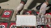 Police in northern Peru port seize cocaine packets with Nazi flag printed on the outside