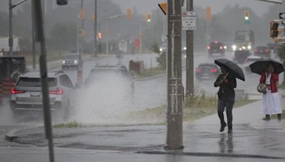 Heavy rain falling in Toronto and the GTA, some flooding on Lakeshore Boulevard near Ontario Place