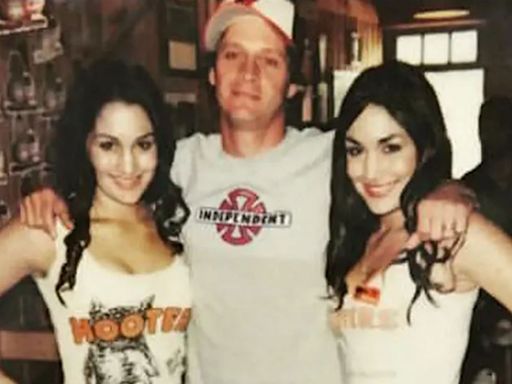 WWE legends Nikki and Brie Bella look almost unrecognizable as Hooters girls