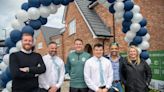 Ex-footballer attends show home opening in area