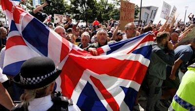 Liverpool riots: a smell of marijuana as missiles thud against police shields