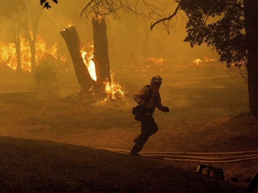 Northern California wildfire forces 13,000 people to evacuate, hotter times ahead