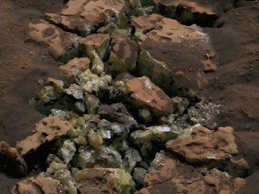 NASA Scientists Startled When Mars Rover Drives Over Rock, Cracking It and Revealing Glinting Crystals Within