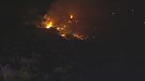 Brush fire emits smoke into night sky in Avondale